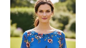 Blue floral dress showing strategic print concentration at neckline and shoulders for balanced proportions