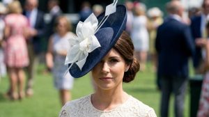 Chic pastel fascinator paired with Derby dress during spring racing event in Louisville