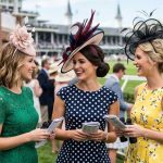 Elegant woman wearing a floral fascinator at Kentucky Derby fashion event in Louisville KY