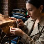 Vintage handbag collector examining factory labels in New York boutique